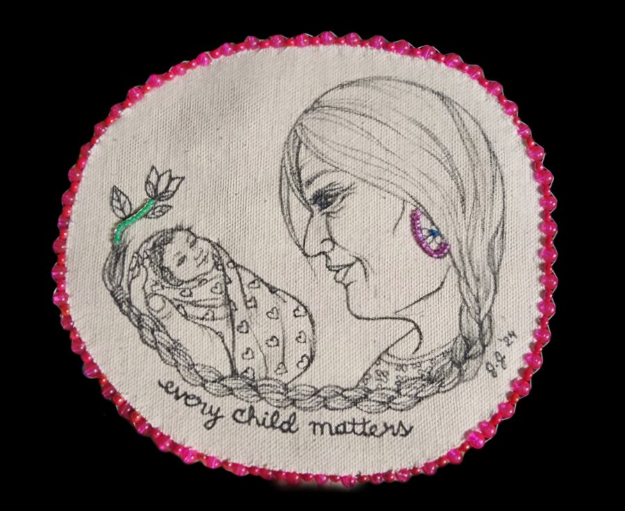 A drawing on a circular piece of canvas of an older woman's face looking at a baby wrapped in a blanket with the words 'every child matters'. The canvas is edged with pink beads.