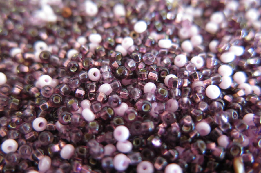 Close up picture of purple and pink beads.