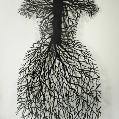 An artwork made of steel of a root system in the shape of a dress.