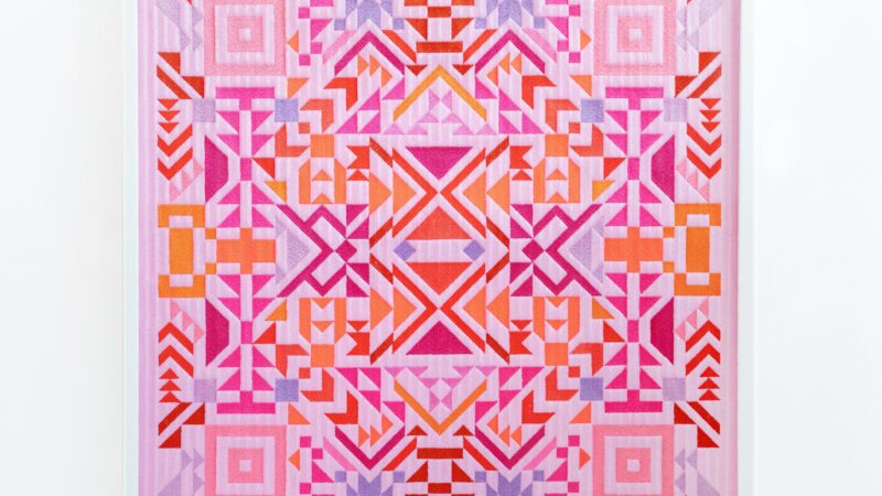 Artwork by Caroline Monnet. A geometric design similar to a quilt in pinks, orange and blue.