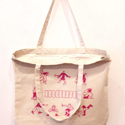 Neutral coloured tote cotton tote bag with one handle hanging down to show the zipper enclosure. An illustration by Cato Cormier in bright pink is printed on the tote bag. The illustration shows 8 cartoonish figures each engaged in a different art activity in a circle around MAWA's logo.